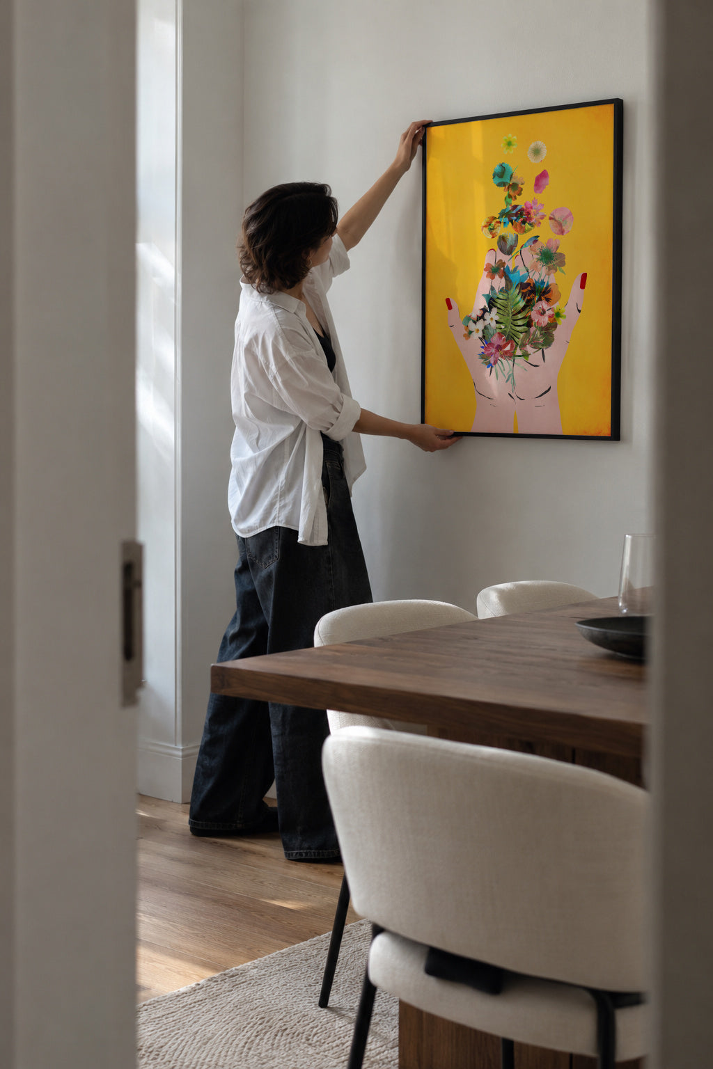 Fridas hands yellow - Framed poster in an interior