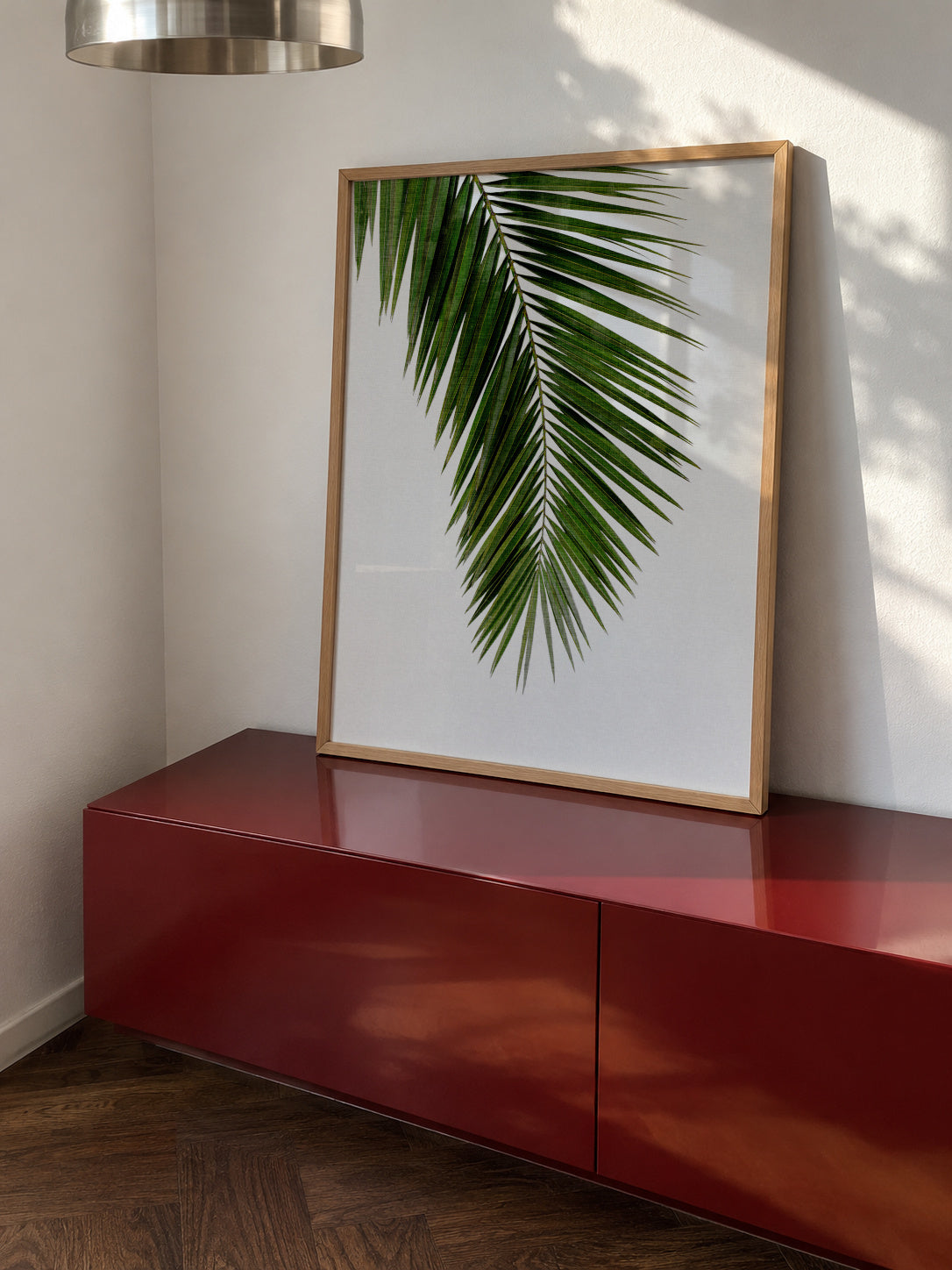 Palm Leaf I - Framed poster in an interior